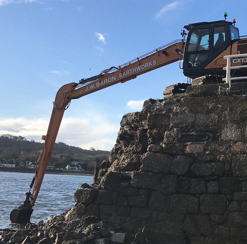 A Long Reach Excavator dredging a lake in Devon