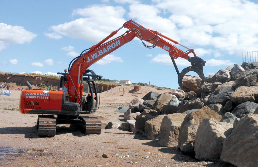J.W.Baron Excavators creating flood defences on a Devon Beach
