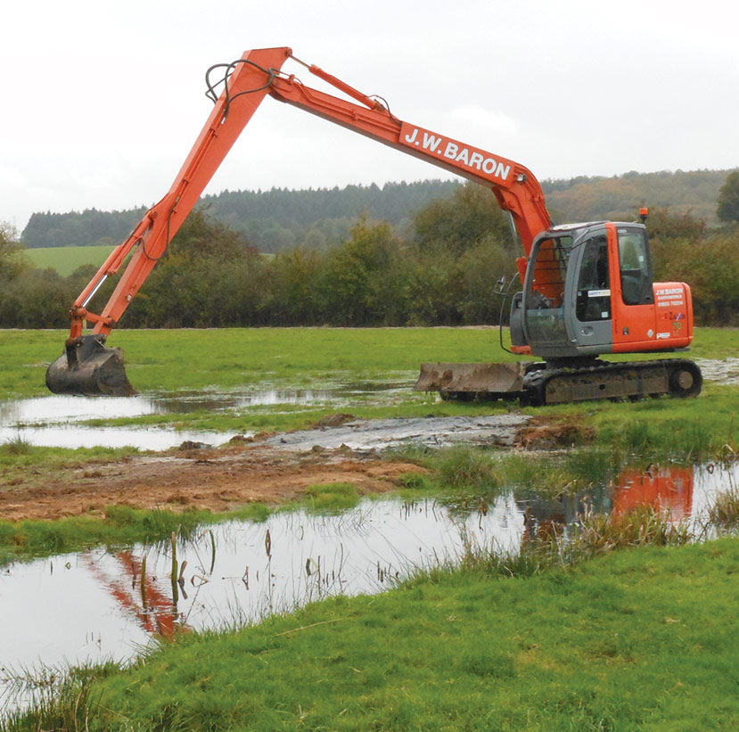 One of J W Baron's Long Reach Excavators undertaking river dredging 