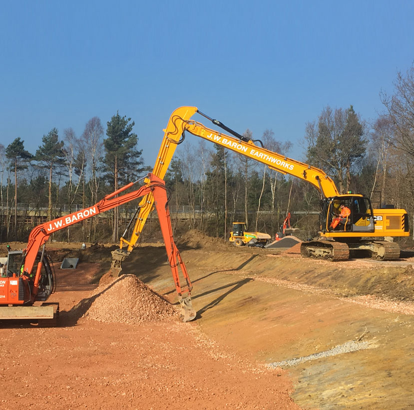 One of J W Baron's Long Reach Excavators undertaking rock armour work 