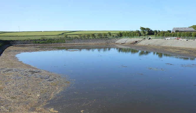 Bulk excavation excavators at a slurry pit construction site in Devon